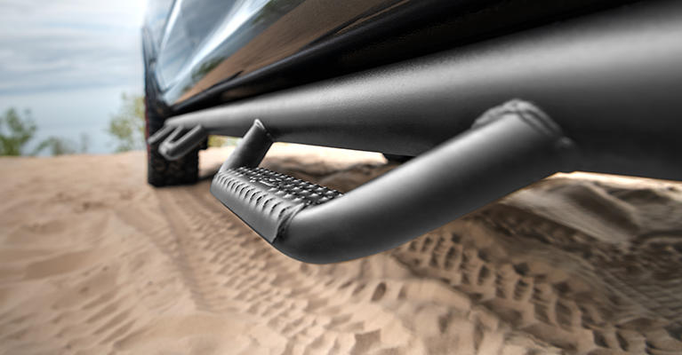 Close-up of a black tubular truck step bar